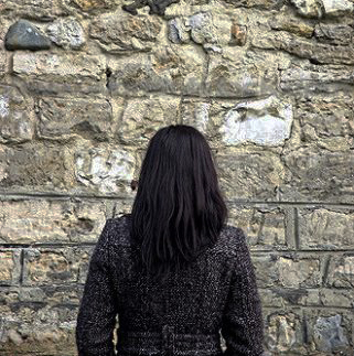 Woman at wall